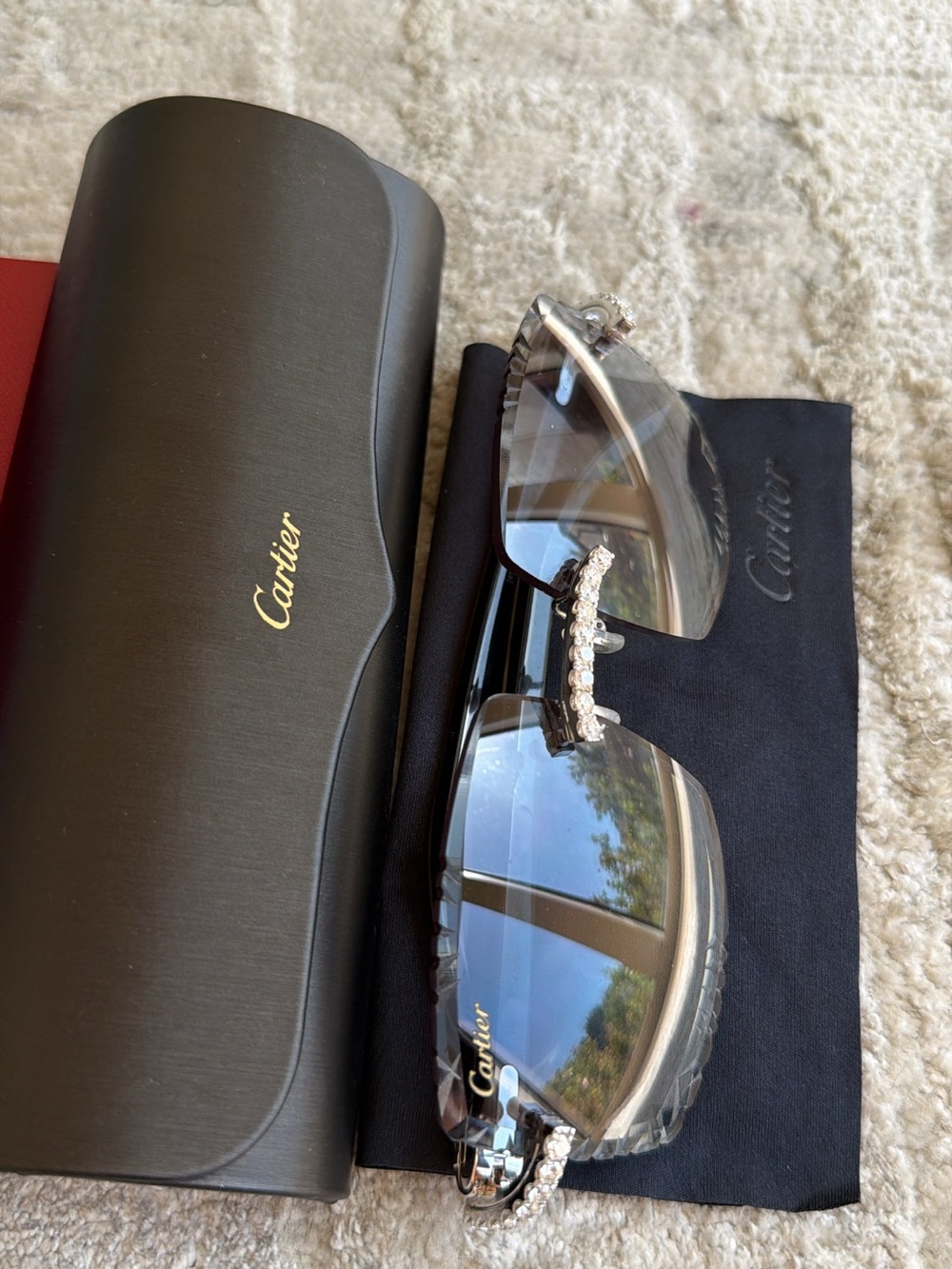 Cartier Black Frame Sunglasses with Clear Gradient Lenses and Crystal Bridge